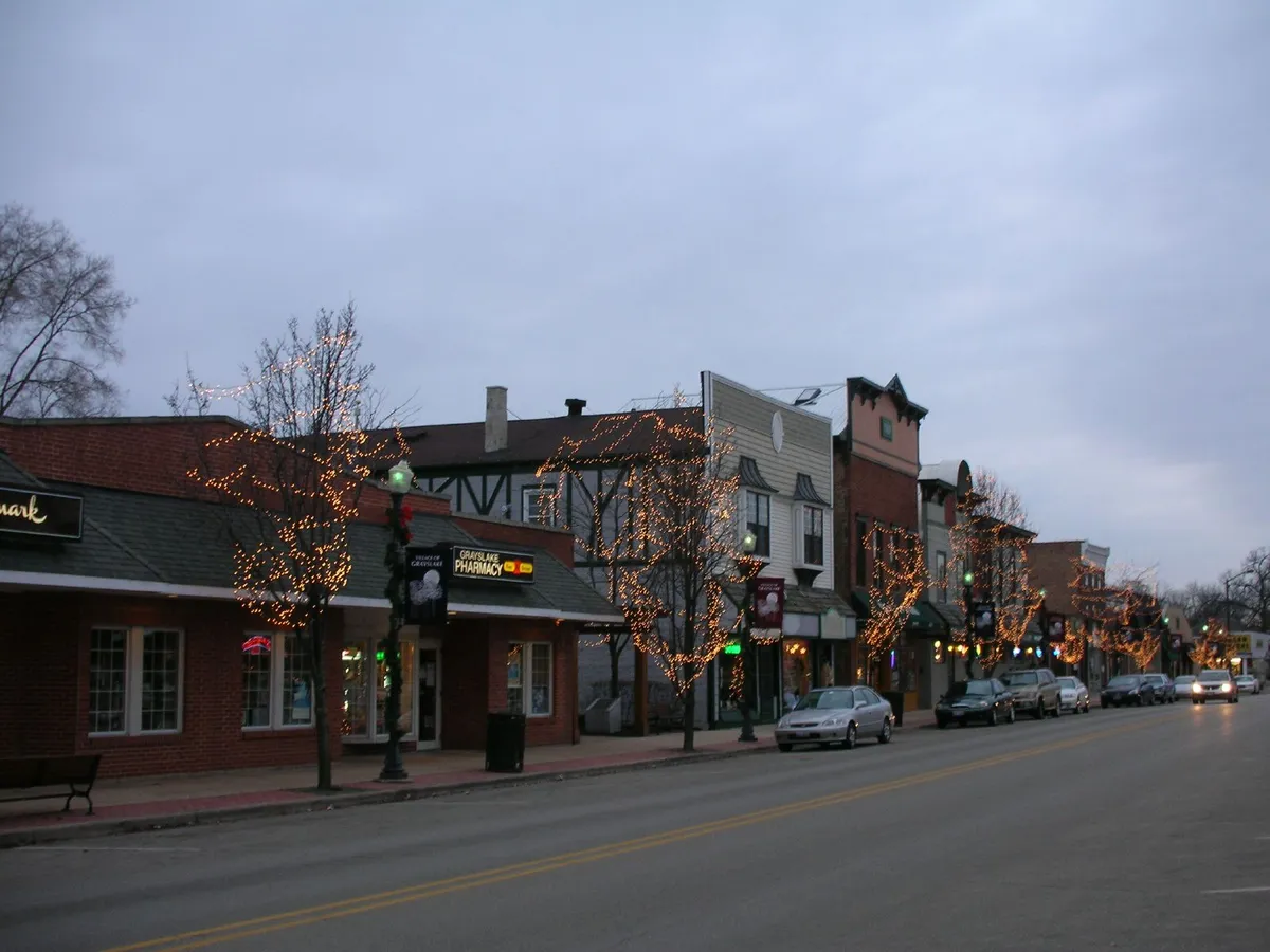 Historic downtown Grayslake storefronts and streetlights along the road