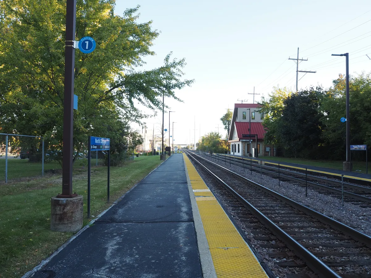 North Chicago station platforms, tracks and station building viewed looking north on an autumn morning